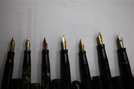 A collection of twenty Mabie Todd Swan fountain pens and a similar ejector pencil,